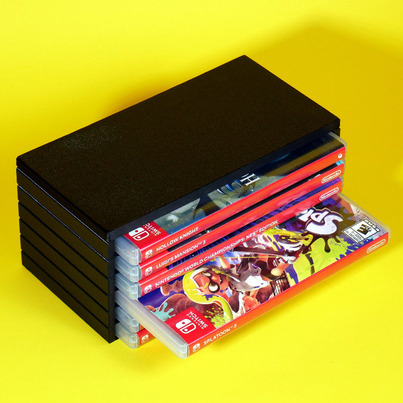 Nintendo Switch game cases stored in a modular stackable organizing tower