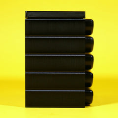 Stack of Sega Genesis or Mega Drive game cartridges in a stackable modular organizer