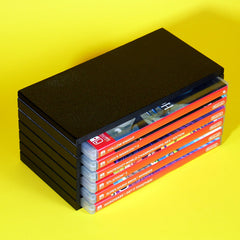 Nintendo Switch game cases stored in a modular stackable organizing tower angled view