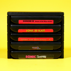 Stack of Sega Genesis or Mega Drive game cartridges in a stackable modular organizer front view