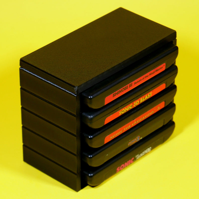 Stack of Sega Genesis or Mega Drive game cartridges in a stackable modular organizer