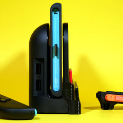 Profile view of Switch 2 dock addon storage installed on dock with system and games